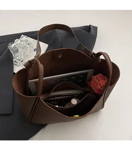 Top view of large tote bag interior showing roomy storage with zipper pocket and magnetic snap