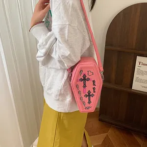Pink coffin-shaped crossbody bag with gothic cross and wing prints for women