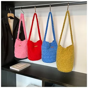 Group shot of colorful fluffy faux fur bucket bags in pink, red, blue, and yellow