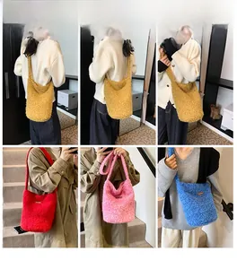 Detailed views of soft plush bucket shoulder bags in yellow, red, pink and blue colors