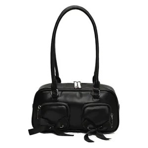 Minimalist black PU leather underarm bag with decorative ribbons and twin front zip pockets