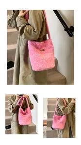 Close-up of pink faux fur bucket bag featuring a soft plush texture and leather logo label