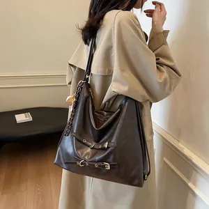 Retro large brown leather tote bag with gold buckle straps and print charm for women