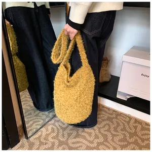 Detail of soft plush mustard yellow crossbody bag with fluffy lamb wool texture