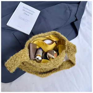 Detail view of mustard yellow plush bag interior with zipper pocket and ample storage