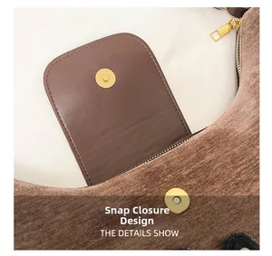 Vue détaillée du sac cabas en daim marron avec fermoir magnétique et fermeture éclair dorée