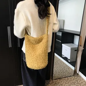 Chic yellow plush tote bag for women shown as a stylish crossbody shoulder bag on a model