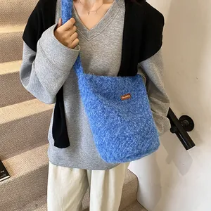 Blue faux fur crossbody bag with soft plush texture and leather star picking patch