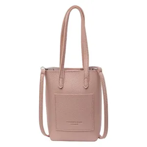 Mini light pink pebbled leather crossbody phone bag for women with dual top handles