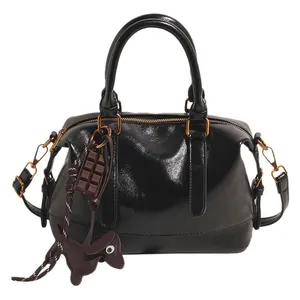 Retro black faux leather pillow handbag with bronze hardware and cute charms