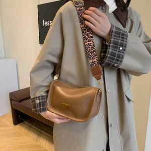 Vintage brown leather Boston bag for women featuring a stylish leopard print wide strap