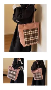 Close-up of pink faux shearling tote bag featuring a contrast plaid pocket and soft texture