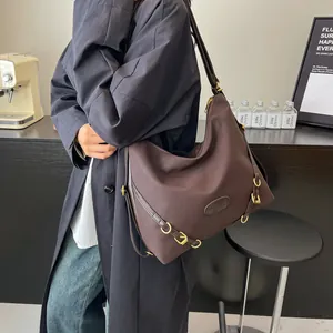 Large dark brown pleated hobo tote bag with metal buckle strap for daily commuting