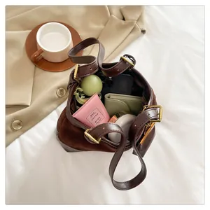 Top view of spacious brown bucket bag showing large capacity for daily items and cosmetics