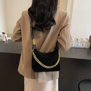 Chic black chain shoulder bag for women with gold link hardware and leather strap