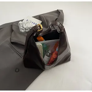 Top view of deep brown faux leather tote bag interior showing large storage capacity