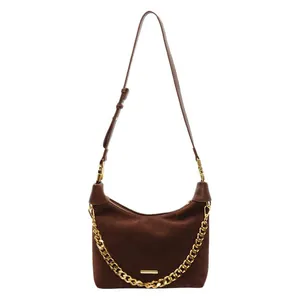 Brown suede hobo bag with a stylish gold chain strap and adjustable crossbody belt