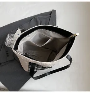 Detail shot of the lamb-like fleece tote bag with internal zip pocket and lining
