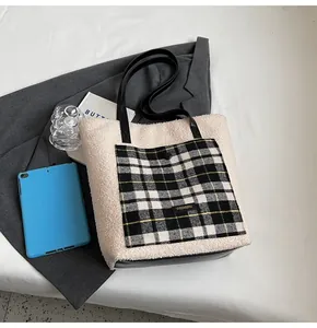 Detailed close-up of a lamb wool tote bag with black and white checkered outer pocket
