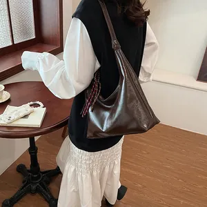 Deep brown glossy leather large shoulder bag for women with minimalist vintage design