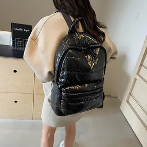 Glossy black puffer backpack for women made of lightweight quilted space cotton material