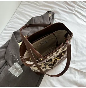 Internal view of leopard print tote bag showing organized zipper pocket and premium lining