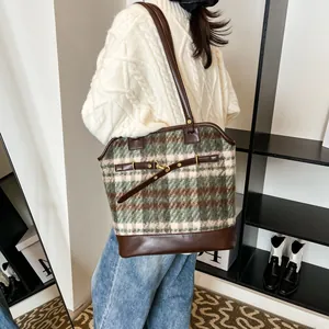 Vintage checkered tweed tote bag with brown leather straps and metal buckle accent
