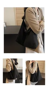 Close-up of minimalist black matte tote bag showing high-quality texture and strap details