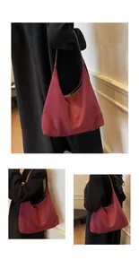 Close-up of burgundy suede hobo bag showing matte texture and minimalist design