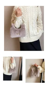 Detail of mauve faux fur handbag with elegant top handle and minimalist brand plate
