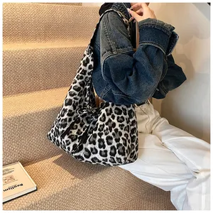 Detail of large leopard print tote bag in soft fabric for casual daily shoulder wear