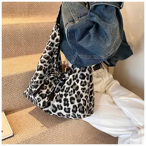 Detail of leopard print canvas tote bag featuring side bow knots for casual daily wear