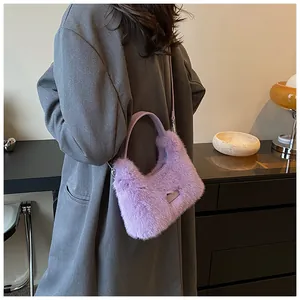 Detail of lavender faux fur handbag with matching leather strap and brand patch