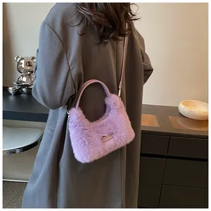 Detailed back view of a plush purple faux fur crossbody bag with a slim shoulder strap
