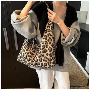 Close-up of leopard print tote bag with soft texture and stylish bow decoration