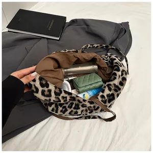 Detail of plush leopard print tote bag interior showing large capacity for daily items