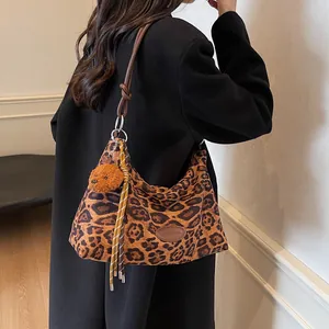 Vintage leopard print hobo bag with leather strap and plush bear charm decoration