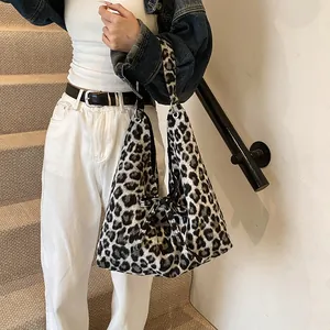 Chic leopard print oversized hobo tote bag with a decorative bow on the shoulder strap