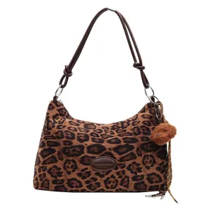 Chic leopard print large tote bag with dark brown straps and plush bear charm decoration