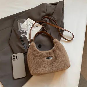 Close-up of fluffy faux fur handbag featuring silver JINGPIN logo and faux leather straps