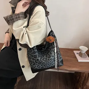Chic leopard print tote bag with leather trim and bear pendant for women's daily commute