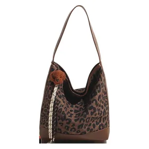 Retro leopard print tote bag with brown shoulder straps and cute plush dog pendant