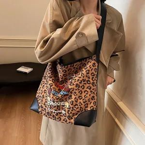 Stylish large leopard print tote bag with cartoon dog illustration and black shoulder strap