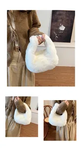 Close-up of white plush handbag featuring soft faux fur and elegant curved handle
