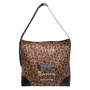 Leopard print tote bag with dachshund illustrations and durable leather corner reinforcements