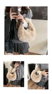 Detail view of a beige faux fur crescent handbag with soft plush texture for women
