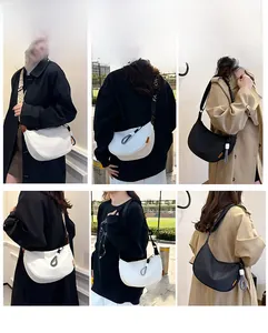 Détails du sac demi-lune minimaliste montrant plusieurs façons de le porter avec de larges sangles