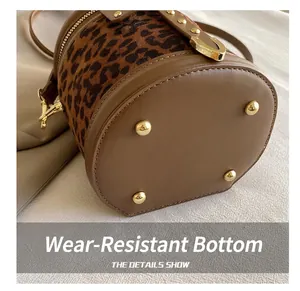 Detail showing the wear-resistant bottom with gold feet and leopard print texture