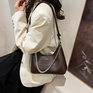 Brown crackle-texture underarm bag with silver chain and metal logo for casual wear