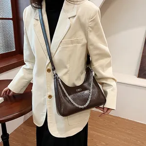 Fashionable dark brown cracked leather underarm bag with silver chain for women
